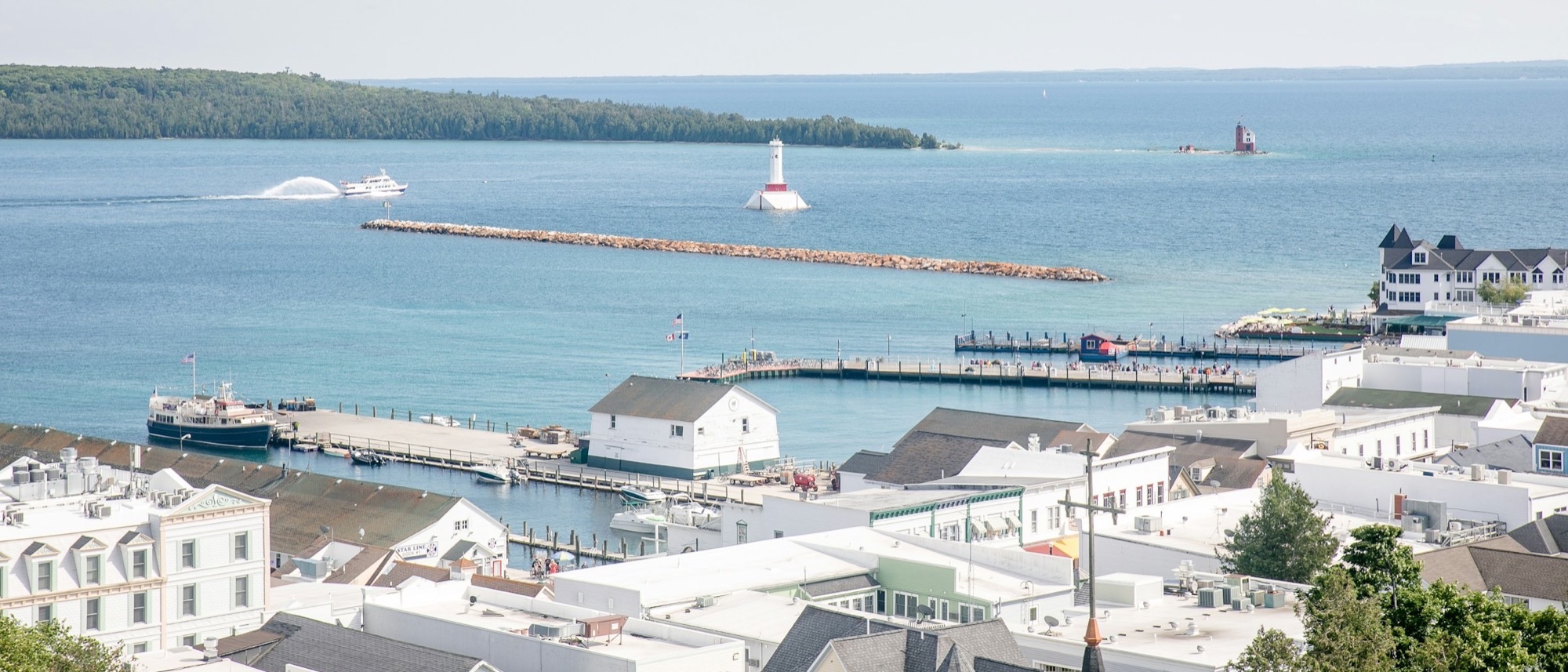 Mackinac Island harbor with ferry docks and Round Island Passage Light